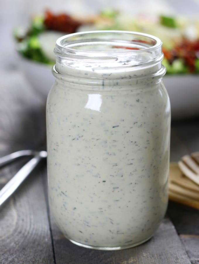 Creamy Low Carb Ranch Dressing sitting in front of a salad.