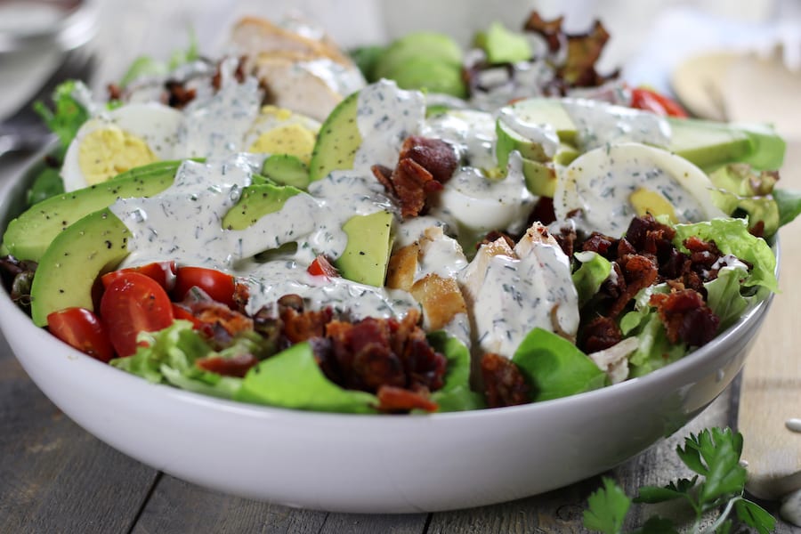 Large salad with Keto Ranch Dressing on top.