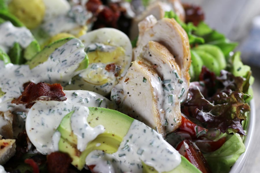 Low Carb Chicken Salad in a bowl with eggs, bacon and avocado.