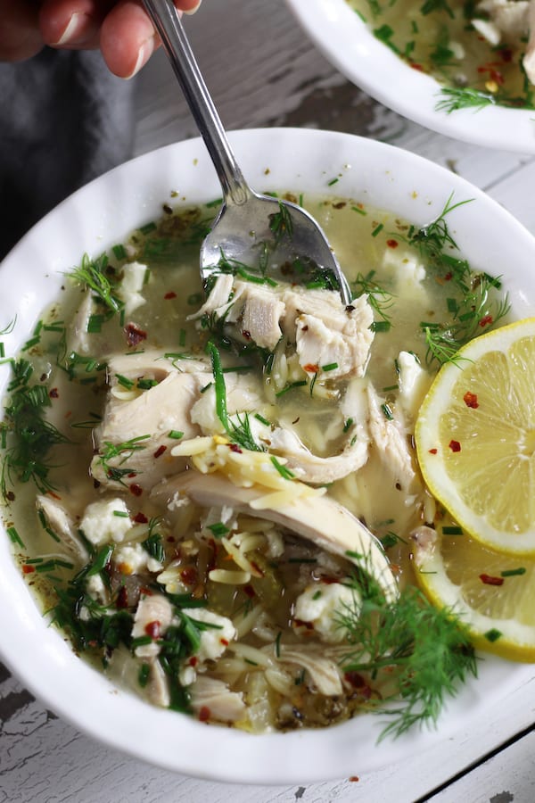 Taking a spoonful of Lemon Chicken Orzo Soup.