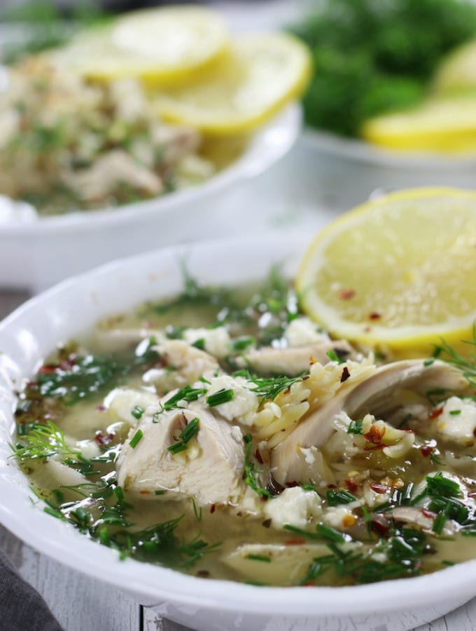Lemon Chicken Soup garnished with dill, feta and chives.