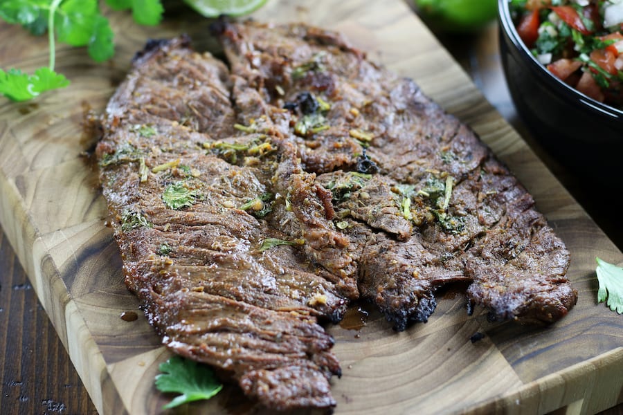 Flap steak marinaded in the Best Carne Asada Marinade with fresh cilantro and salsa.