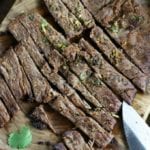 Marinated, grilled and cut flap steak from Carne Asada Recipe.