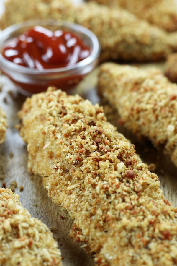 Healthy Baked Chicken Strips with a side of ketchup.
