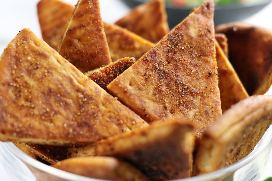 Several Sea Salt and Spice Pita Chips in a bowl.