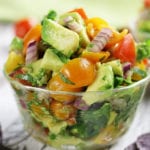 Chunky Guacamole Salsa with blue tortilla chips.