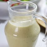 Salad dressing bottle of Creamy Lemon Tahini Salad Dressing.