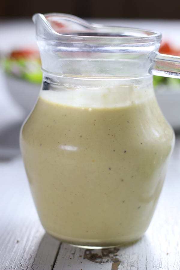 Chilled Tahini Lemon Olive Oil Dressing in a container.