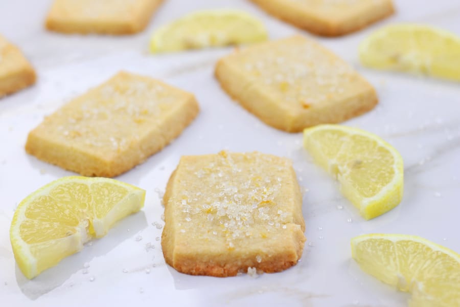 Best Lemon Shortbread Cookies on white marble tile.