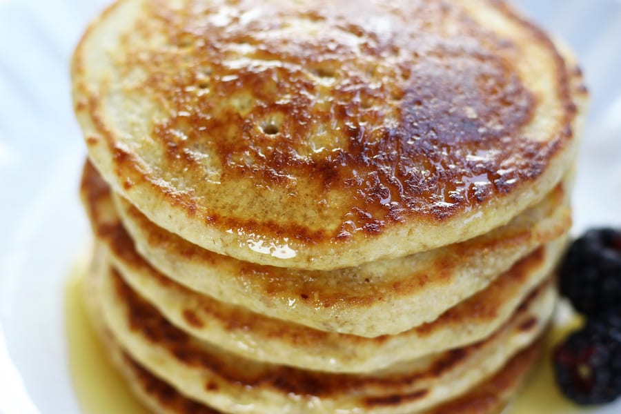 Overhead photo of Oat Flour Pancake Breakfast on a white plate.