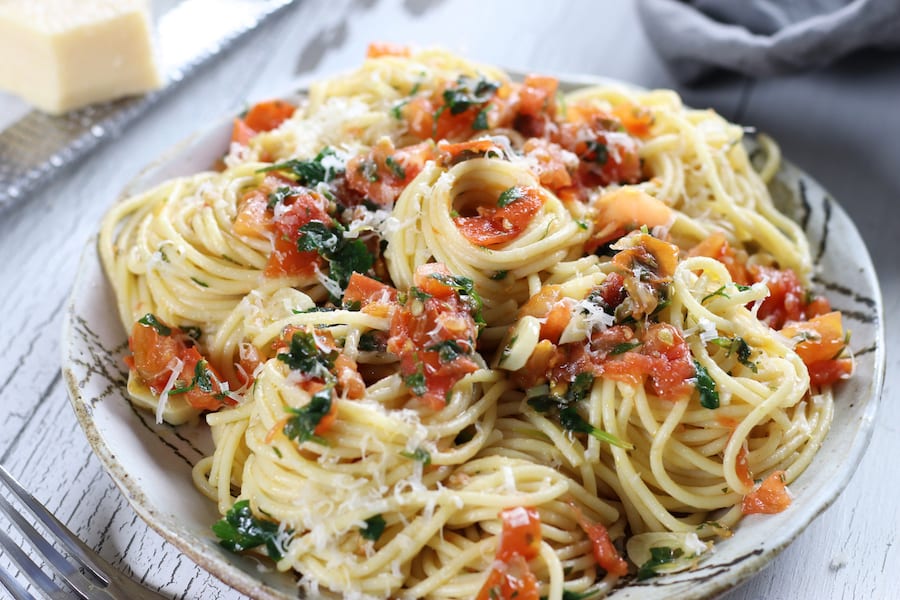 Tomato Olive Oil Pasta cooked with capers and Italian parsley.