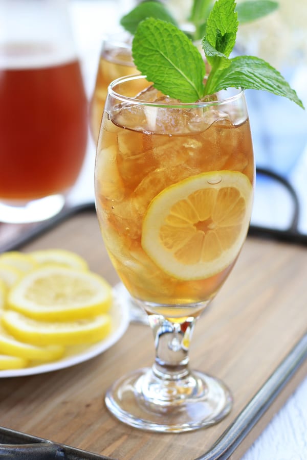 Table setting with two glasses and a pitcher of the Best Iced Tea.