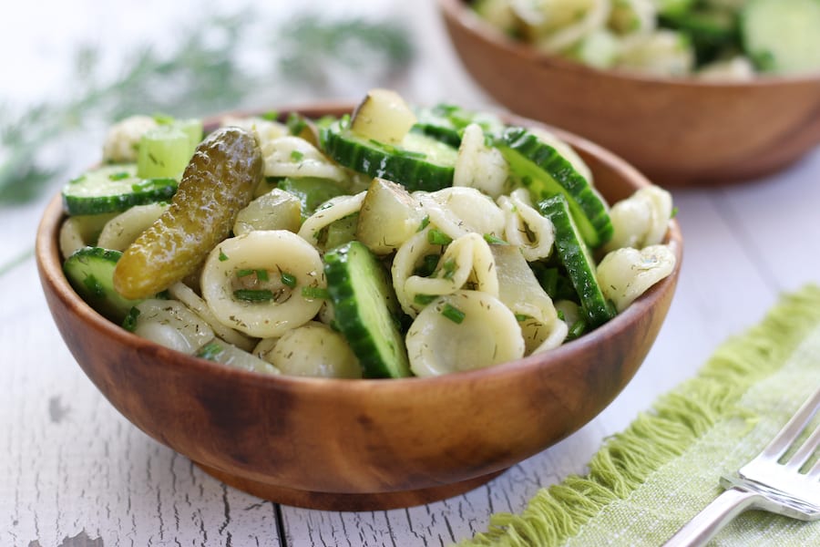 Two brown bowls of Dill Pickle Salad with Pasta.