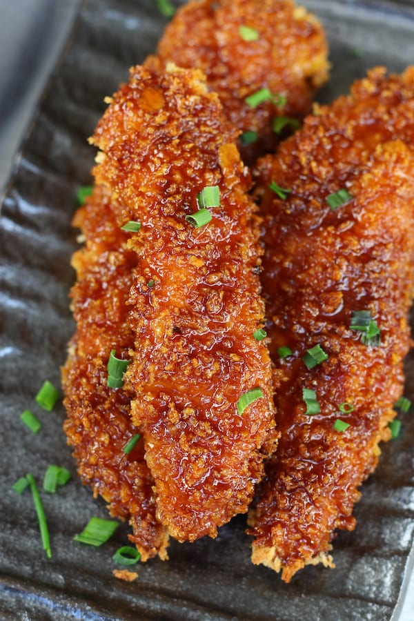 Overhead shot of Homemade Chicken Tenders with sticky Asian sauce.