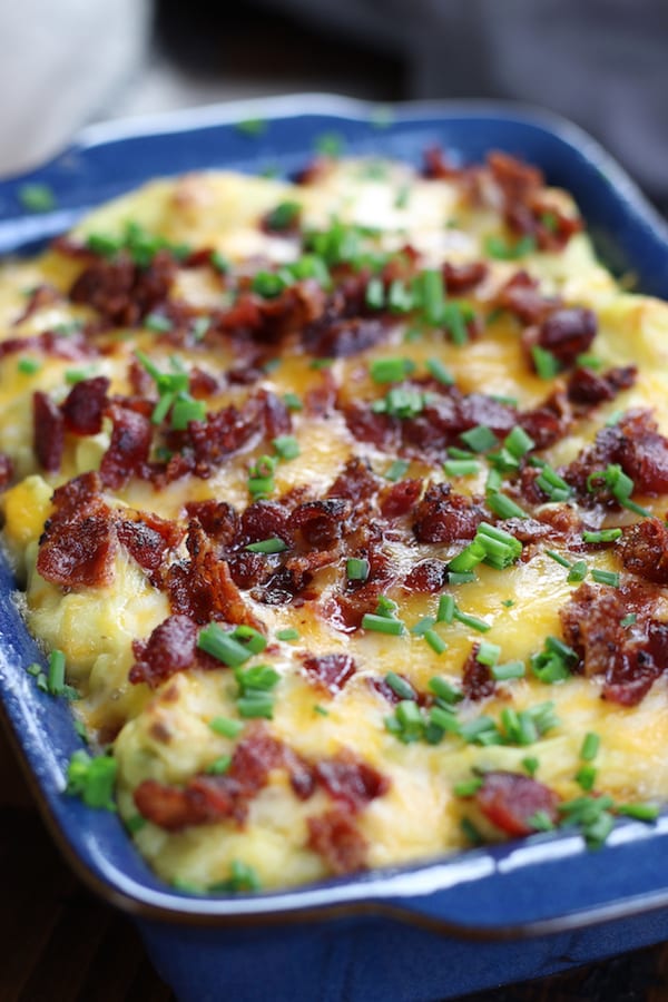 Loaded Mashed Potatoes in a blue baking dish.