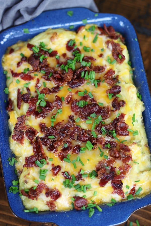 Overhead photo of Potato Casserole with Sour Cream in a blue baking dish.