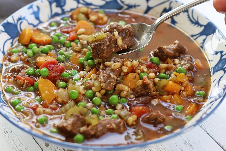 Taking a spoonful of Vegetable Beef Barley Soup.