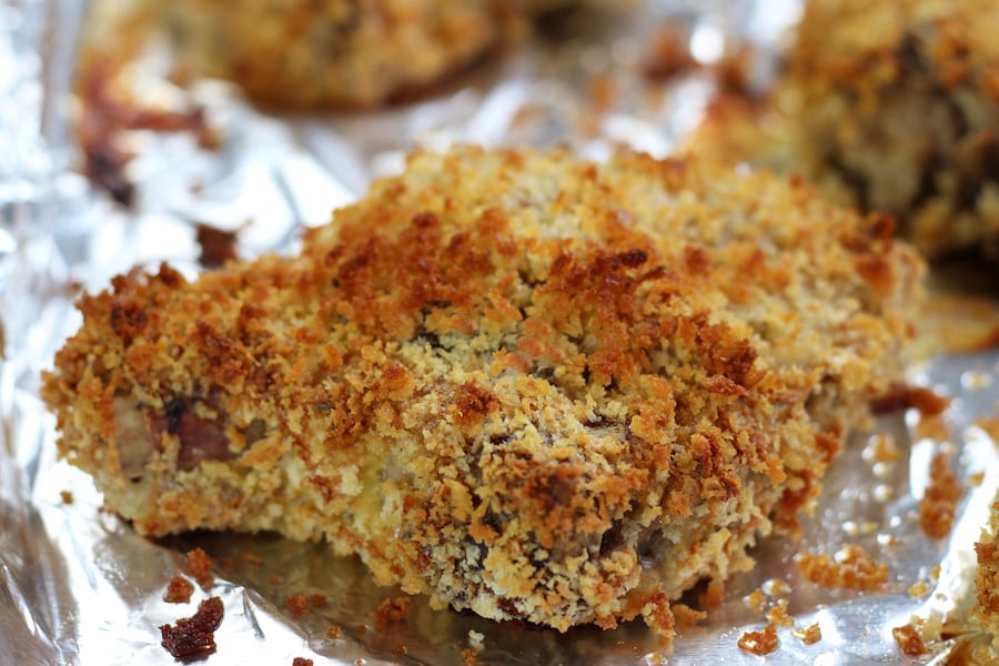 Baked Pork Chops on a cookie sheet with aluminum foil.