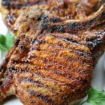 Easy Broiled Pork Chops on a white plate.