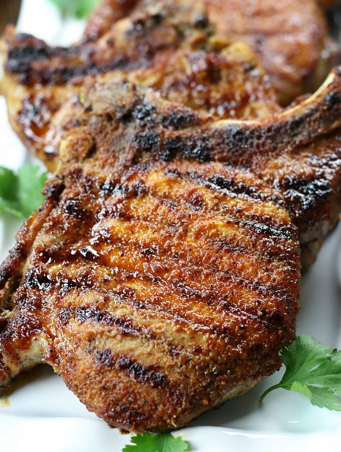 Easy Broiled Pork Chops on a white plate.