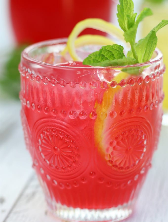 Hibiscus Pink Lemonade in an etched glass with ice.