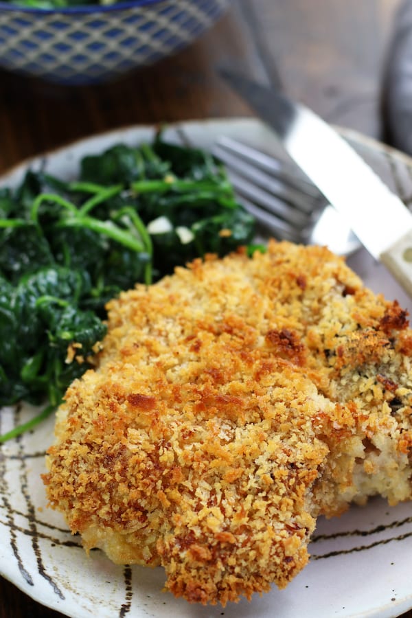 Oven Fried Pork Chops recipe with one golden pork chops served on a plate.