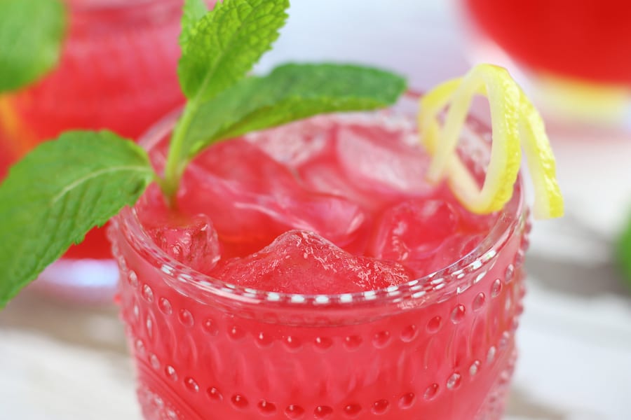 A refreshing glass of Pink Hibiscus Lemon Aide.