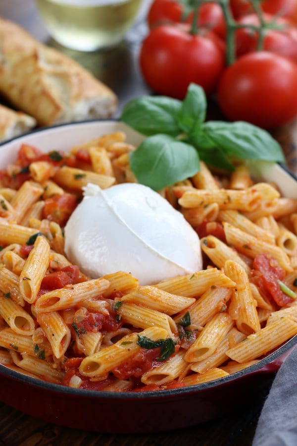 Pomodoro Pasta on penne noodles with burrata in center.