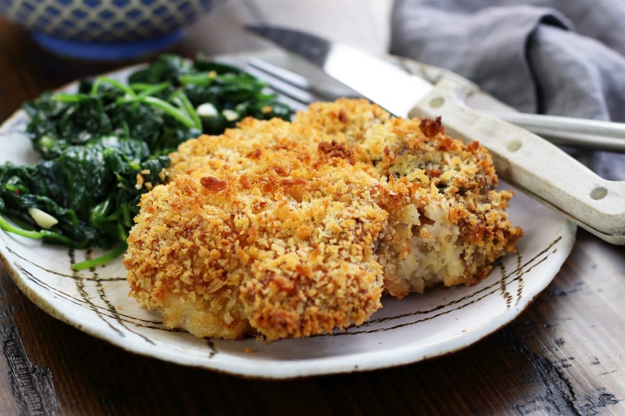 Pork Chops In Oven recipe with a knife and a fork on a plate.