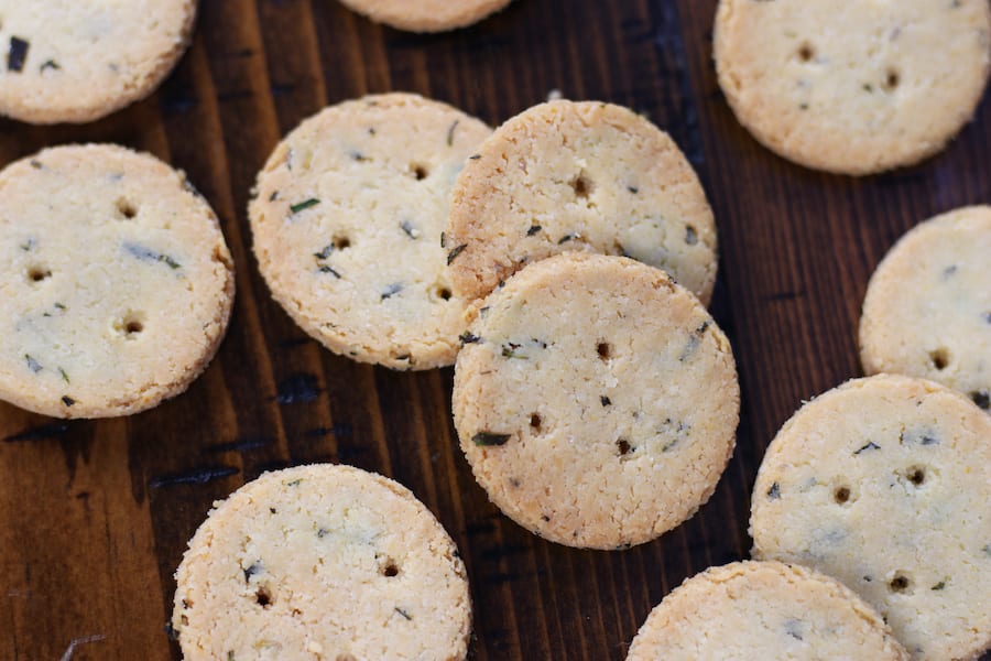 Several round Almond Flour Crackers on a table.