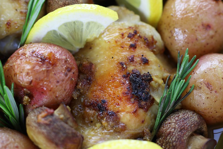 Up close photo of Chicken Potato Bake with mushrooms, lemon and rosemary.