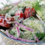 Up close photo Creamy Cucumber Tomato Salad.