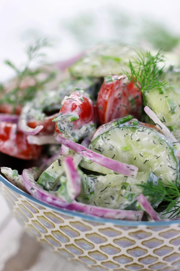 Cucumber Tomato Salad in a patterned blue bowl.