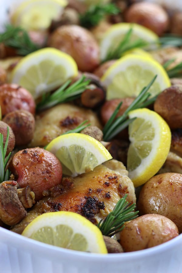 Lemon Rosemary Chicken in a white baking pan.