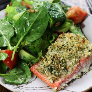 Panko Salmon on a grey striped plate with a salad.