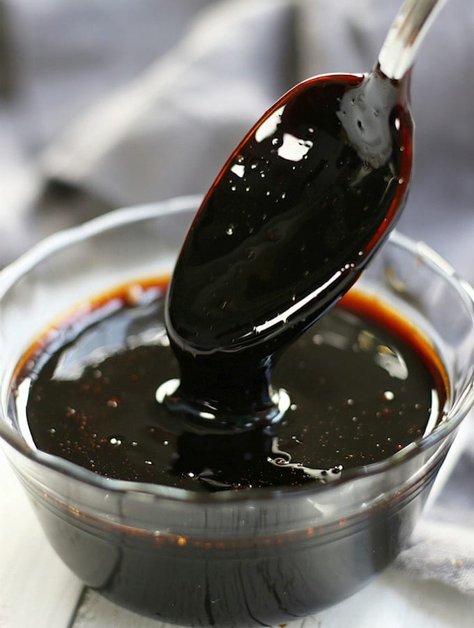 Balsamic Glaze coating a spoon that was dipped into it.
