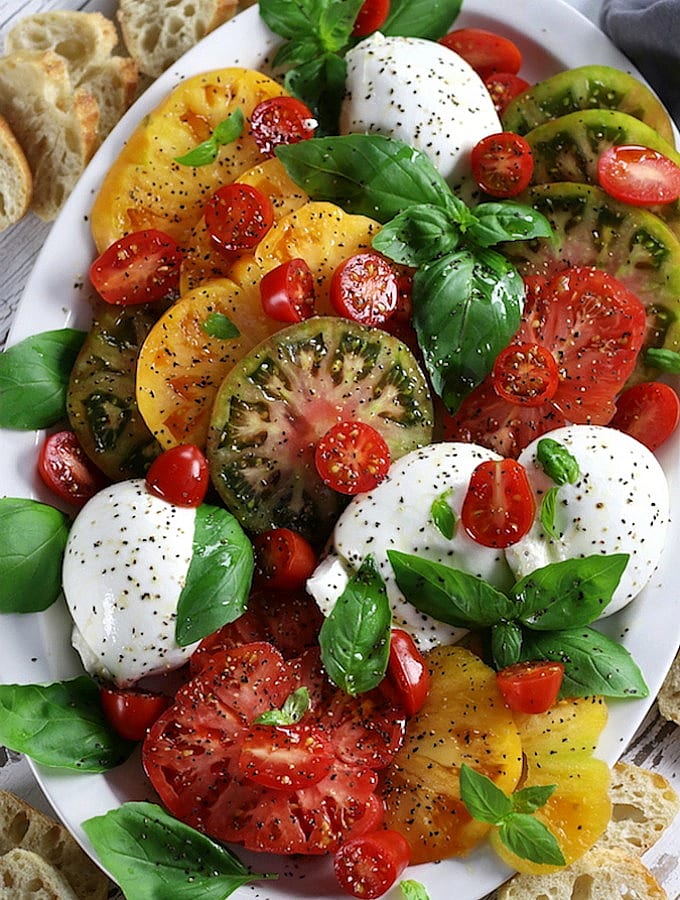 Overhead photo of a Burrata Caprese platter.