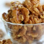 Candied Walnuts in a clear glass bowl.