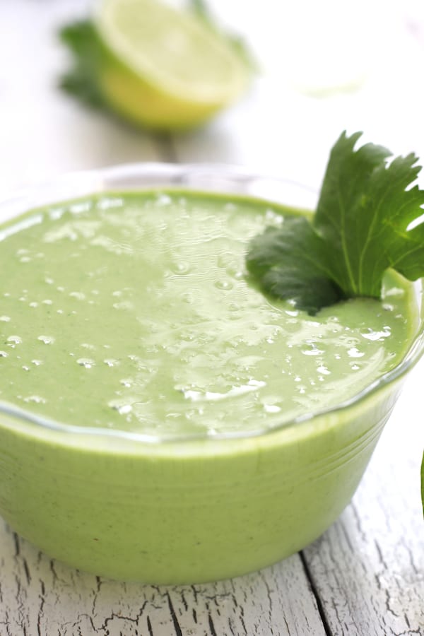 Cilantro Lime Sauce garnished with a large cilantro leaf.