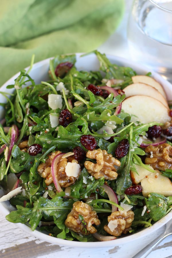 Overhead photo of Pear and Rocket Salad in a white bowl.