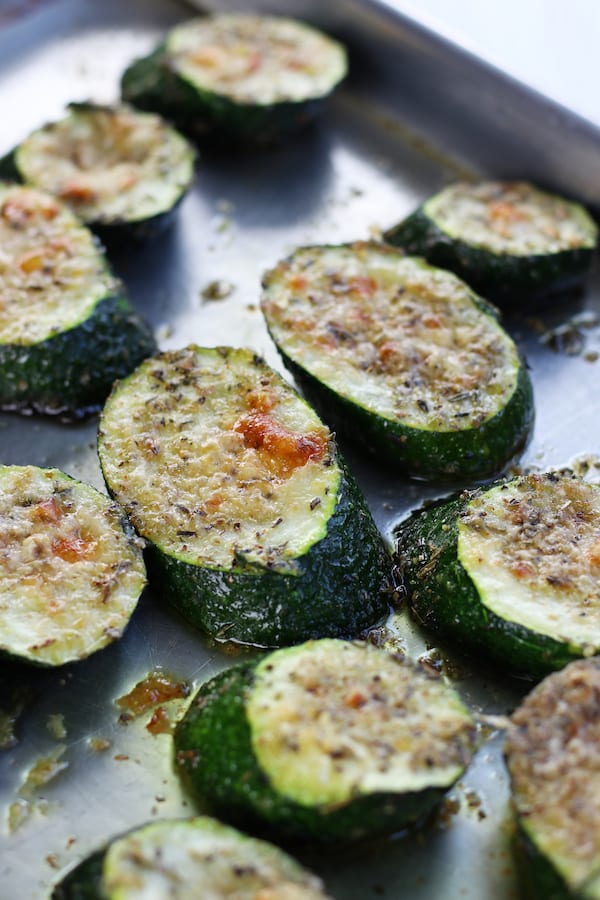 Zucchini slices from Roasted Zucchini Recipe on a cookie sheet.