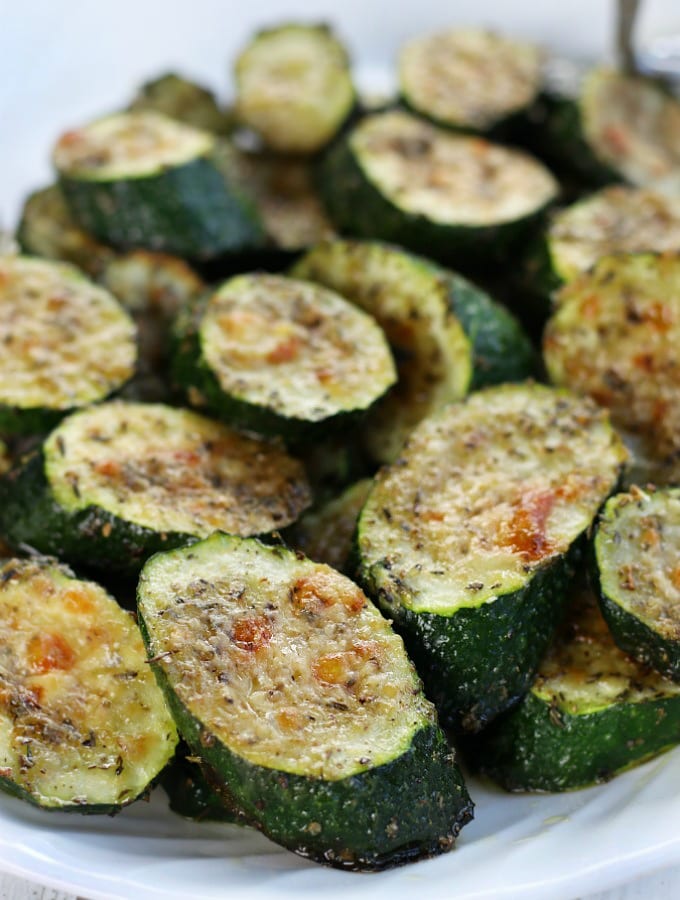 Roasted Zucchini Slices on a white platter.