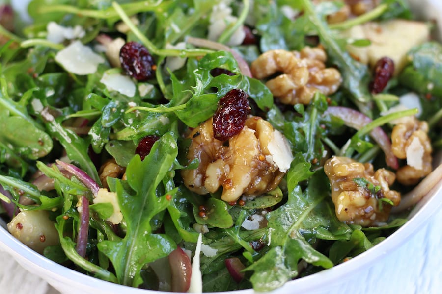 Rocket Pear Walnut Salad in a white bowl.