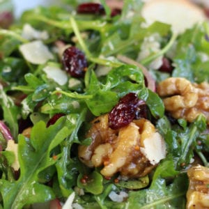 Up close Rocket Salad with cranberries, pear and walnuts.