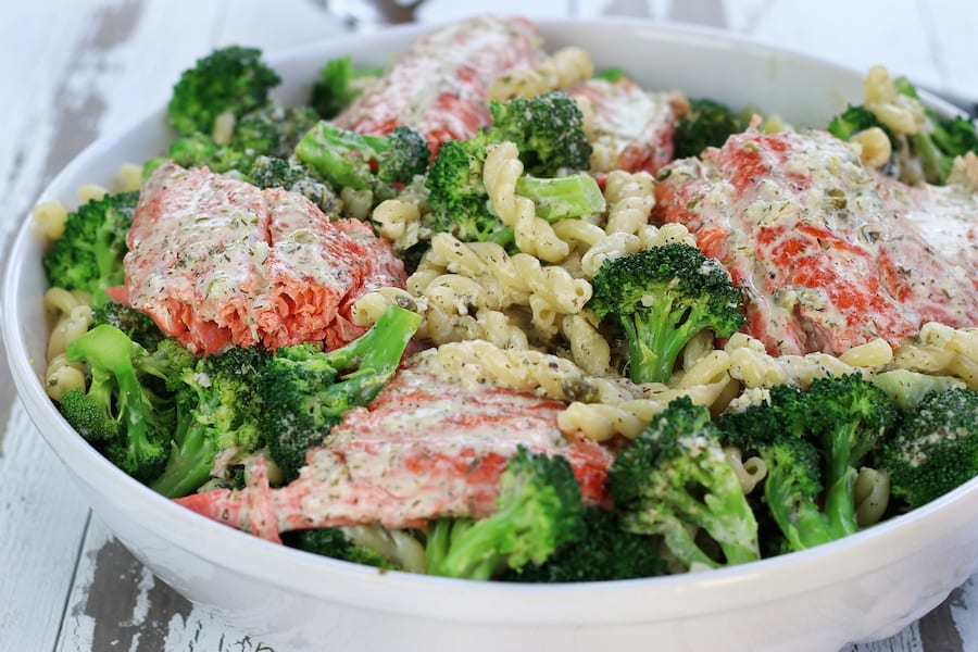 A large bowl of Creamy Salmon Pasta with broccoli.