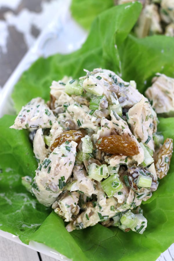 A scoop of Shredded Chicken Salad Recipe with tarragon, sunflower seeds, chives and celery.