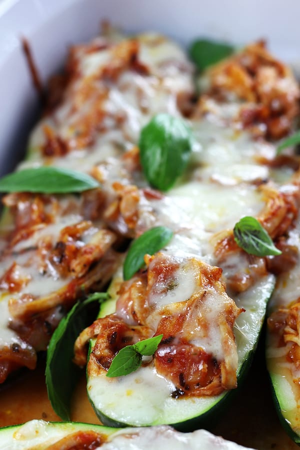 Chicken Stuffed Zucchini in a white baking dish.