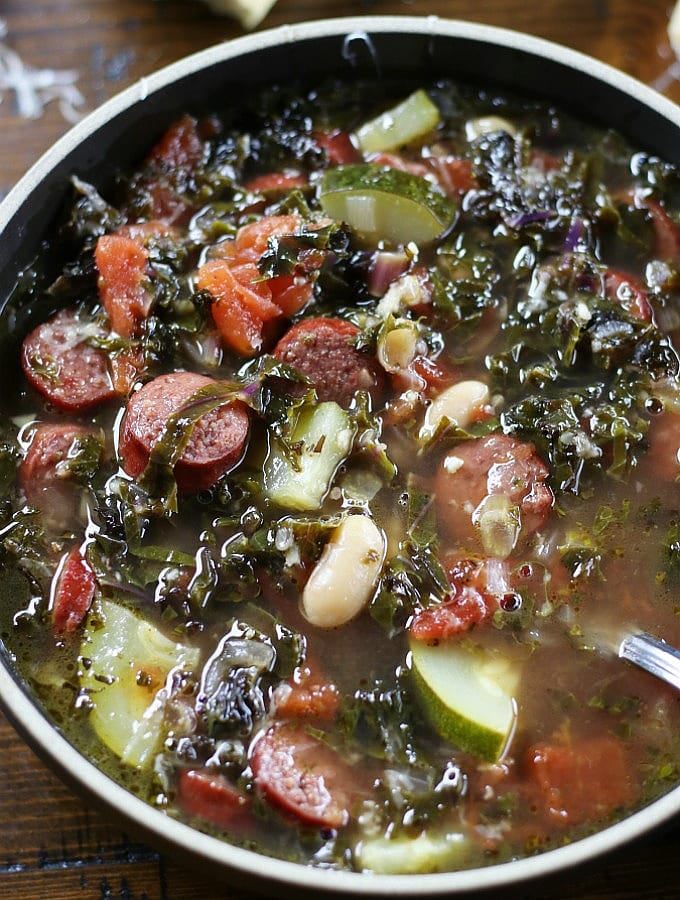 Overhead picture of Tuscan Kale Soup with a spoon.