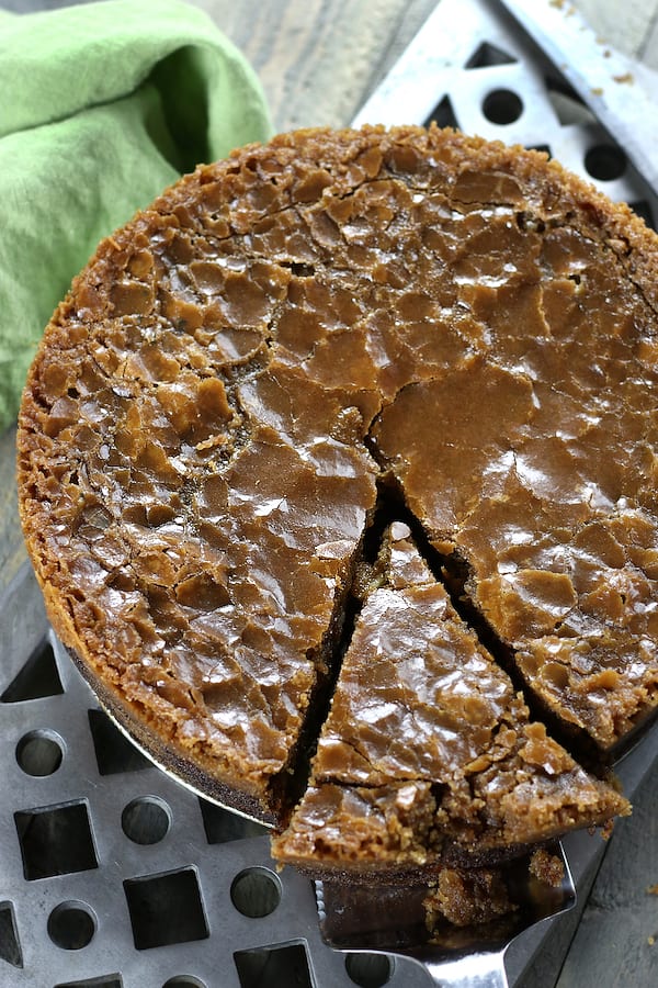 A slice being taken out of Fresh Apple Cake.