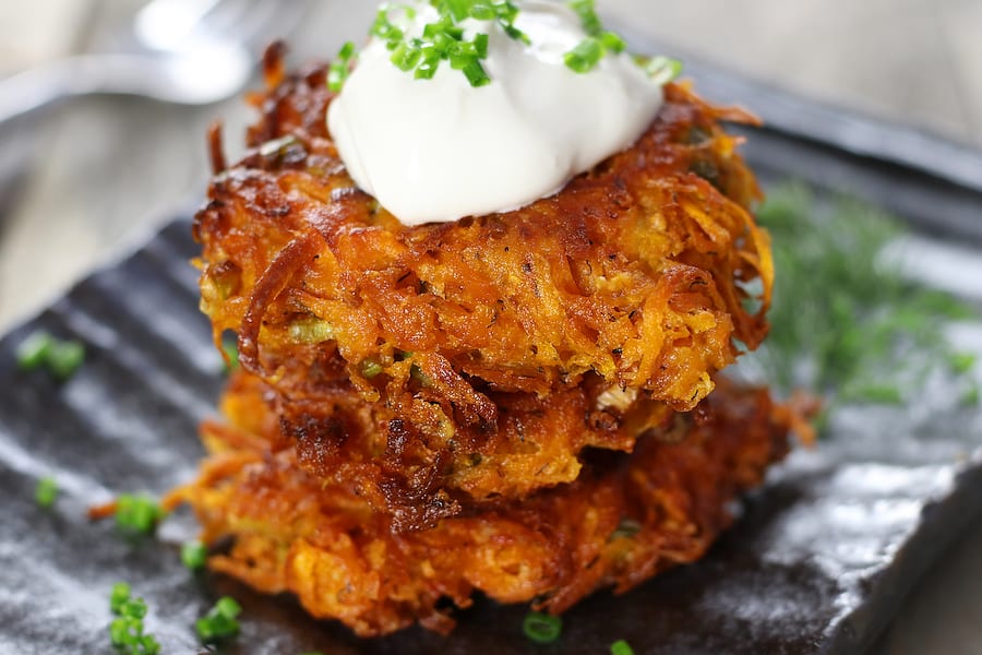 Three Sweet Potato Fritters with sour cream.